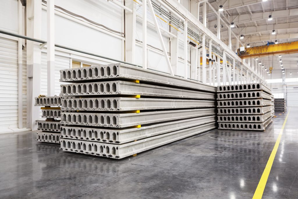 Stack of precast reinforced concrete slabs in a house-building f